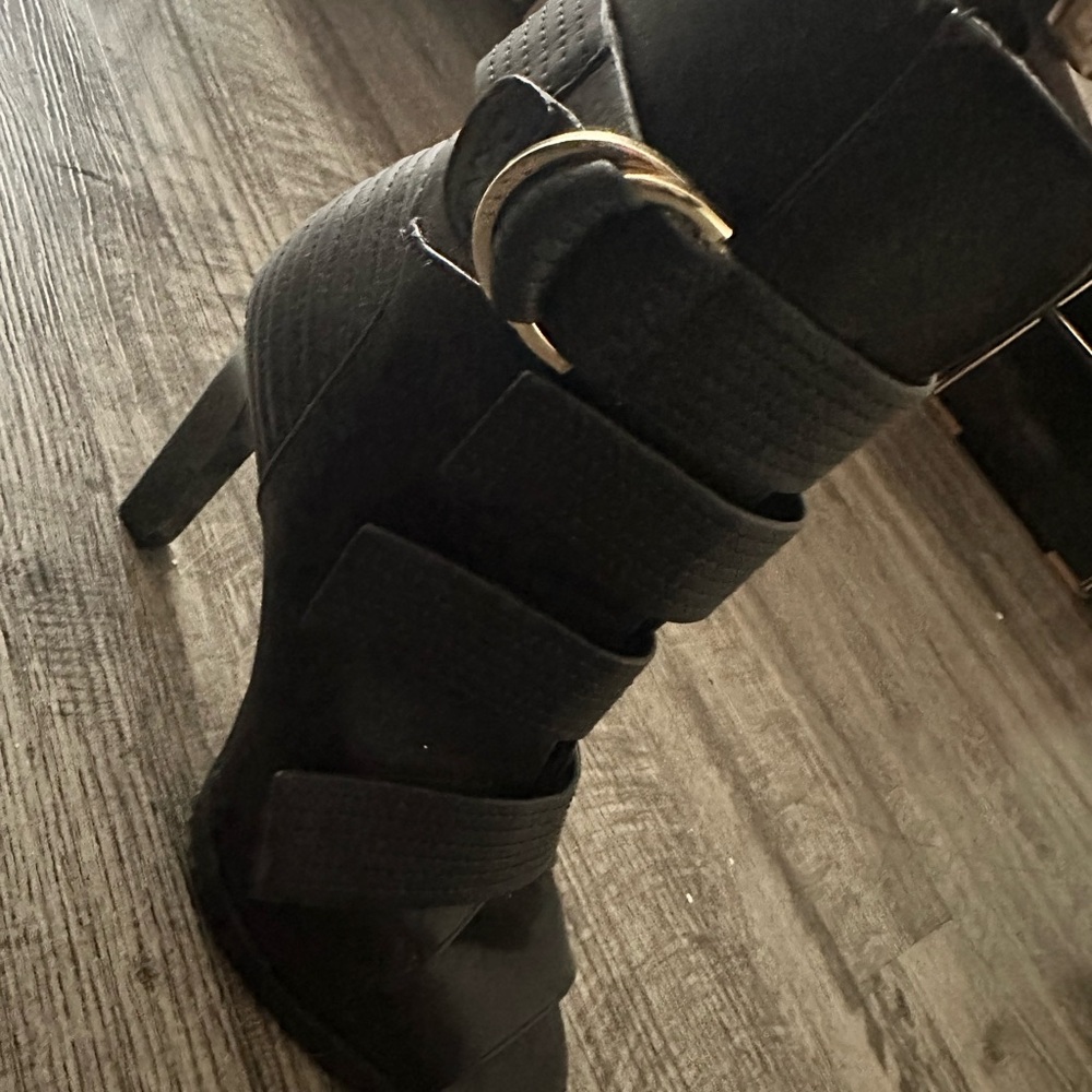 Sleek Black Heeled Boots with Straps